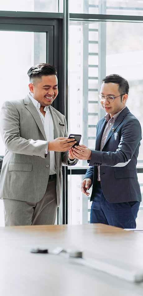 Two Pentaware managers reviewing a facility report together